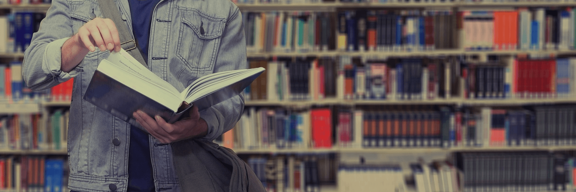 image of a man flipping through a book page
