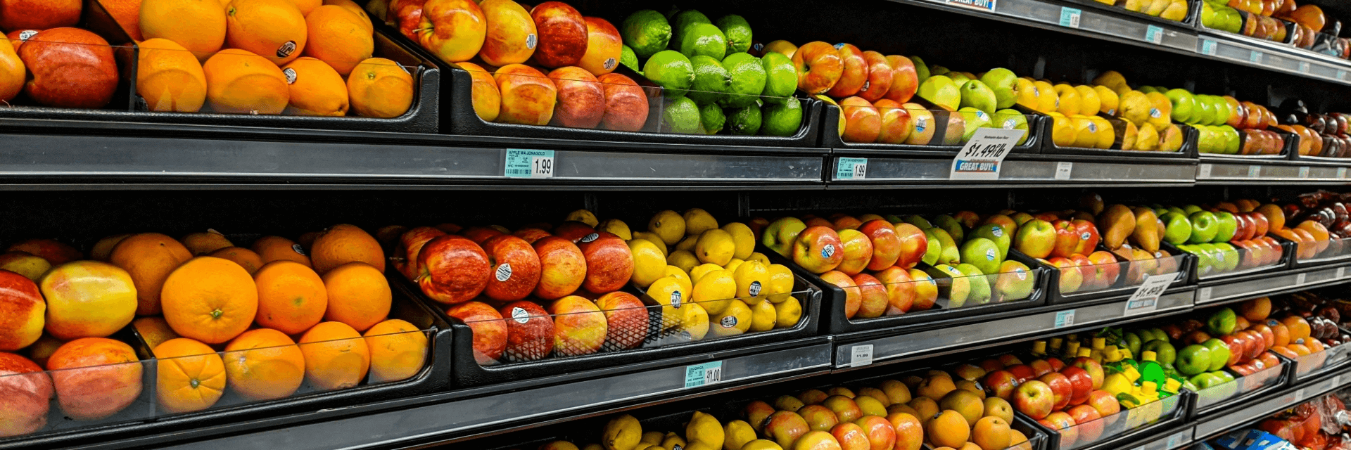 image of fruits on grocery market shelves